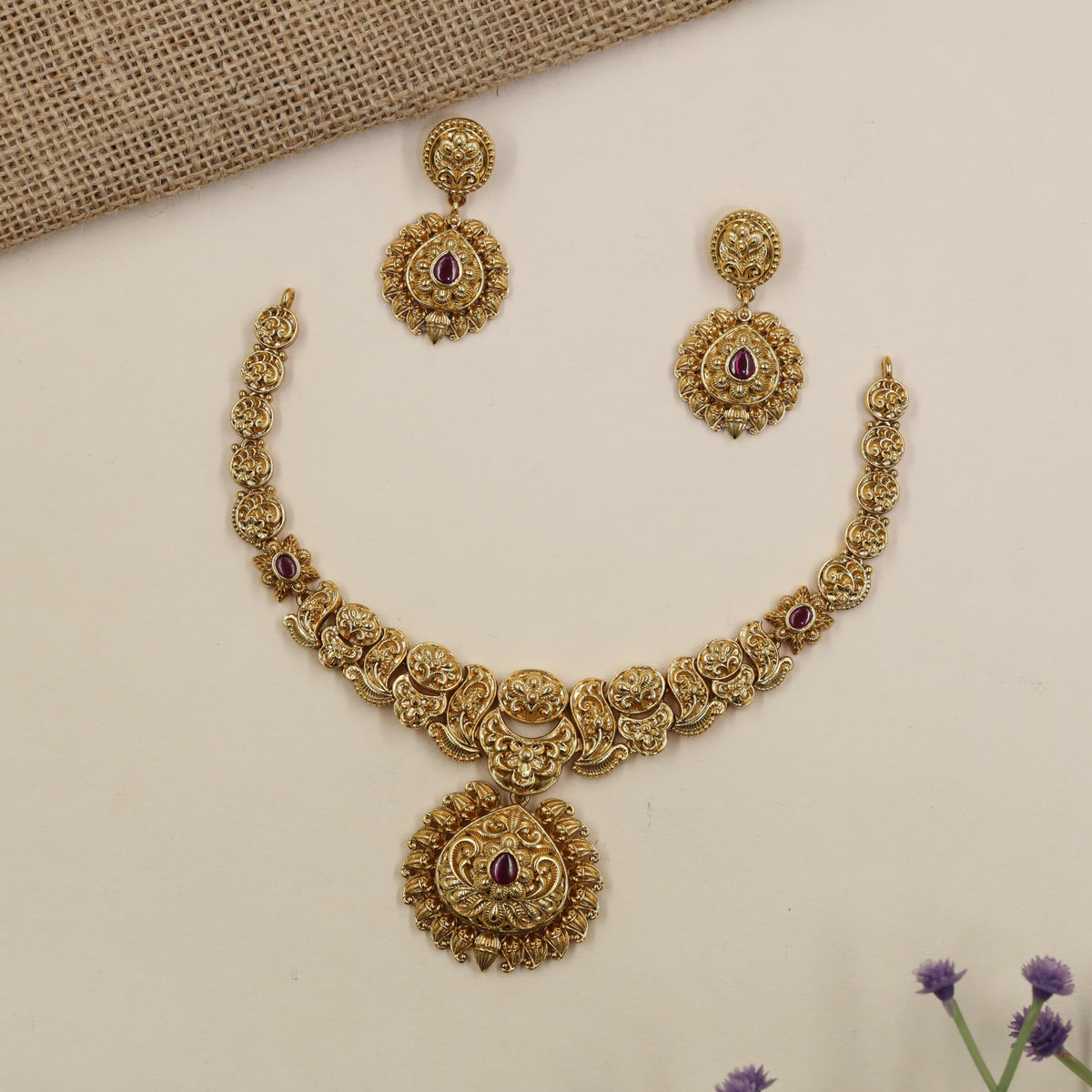 Intricate antique Necklace featuring floral roundels and an elaborate pendant frame