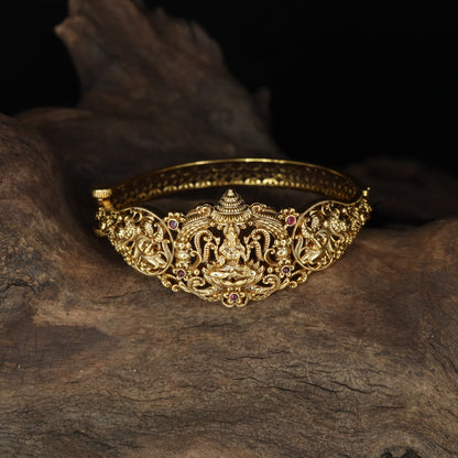 South Indian temple-style Kada showcasing sculpted Lakshmi artistry and elaborate sidework