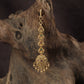 Occasion Wear Tikka with intricate floral detailing and an elaborate pendant arrangement