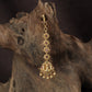 Regal Lakshmi Tikka with floral links and an ornate deity pendant