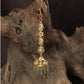 Signature Lakshmi Tikka with intricate circular elements and a richly detailed pendant