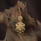 Regal peacock Tikka with ornate floral detailing and graceful hanging drops