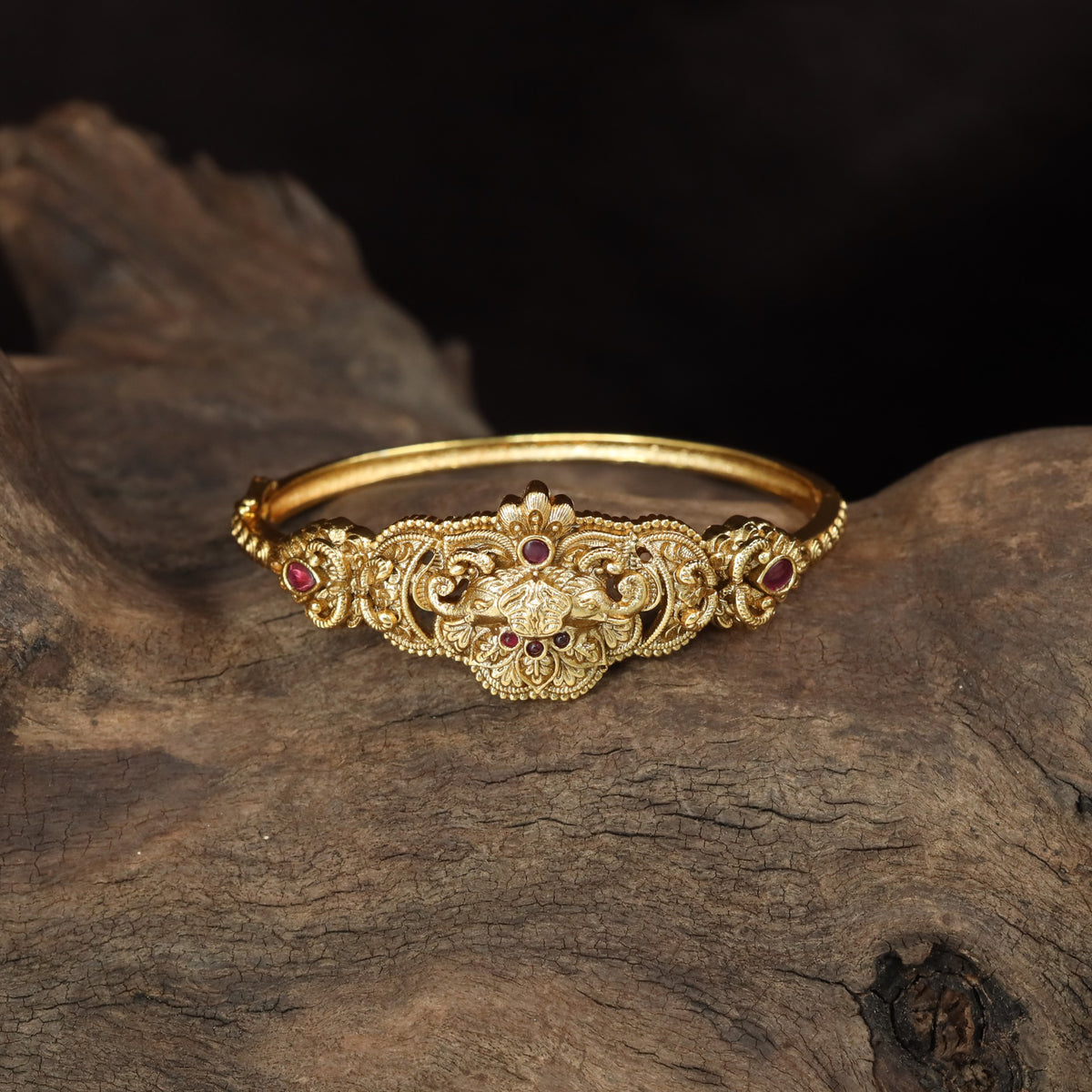 Royal Kada with a prominent central floral arrangement and ornamental side accents
