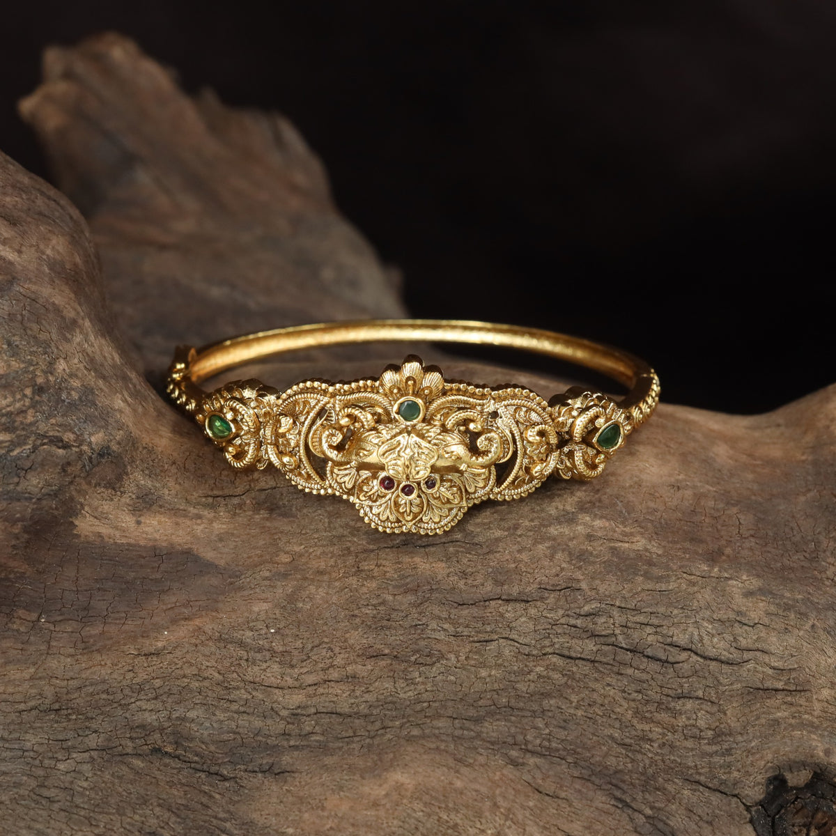 Royal Kada with a prominent central floral arrangement and ornamental side accents