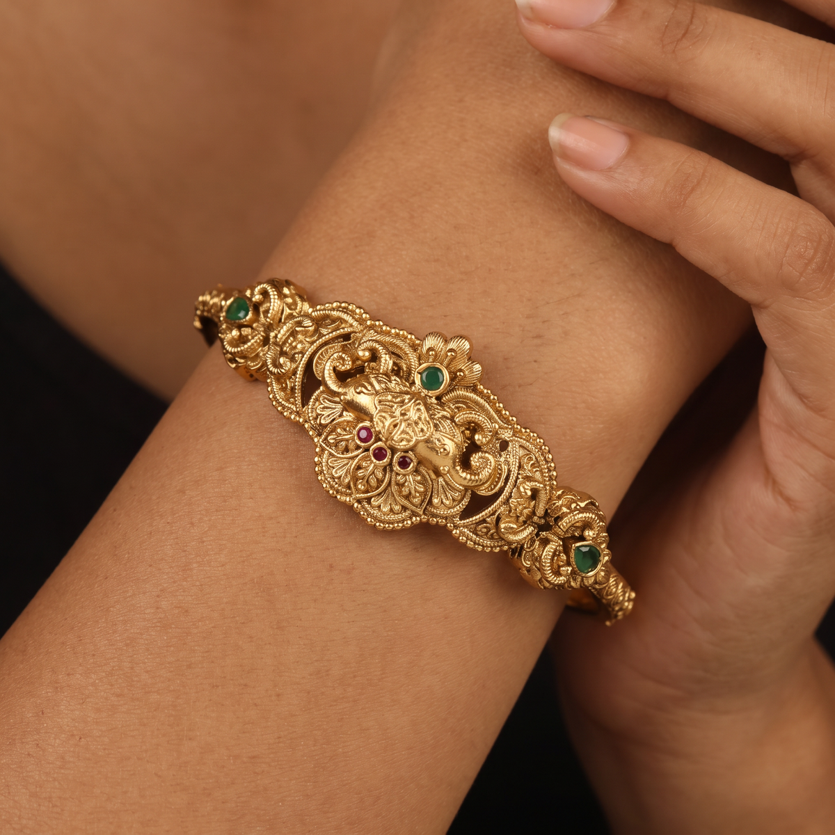 Royal Kada with a prominent central floral arrangement and ornamental side accents