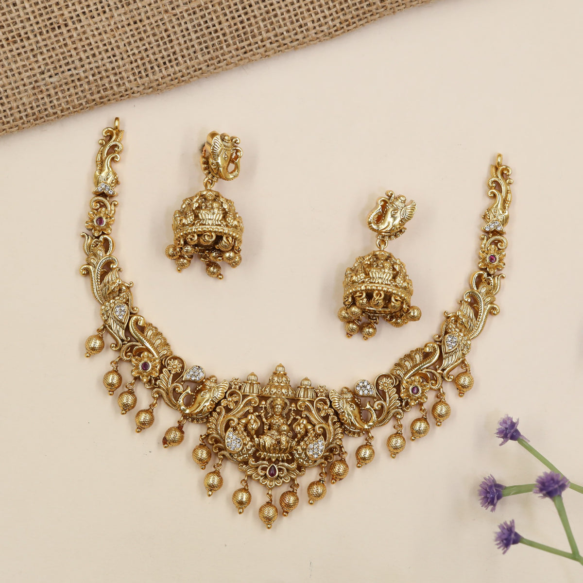Royal Lakshmi necklace featuring elaborate curves, floral detailing and hanging accents