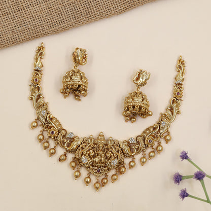 Royal Lakshmi necklace featuring elaborate curves, floral detailing and hanging accents