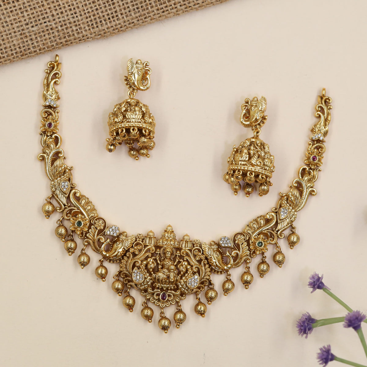 Royal Lakshmi necklace featuring elaborate curves, floral detailing and hanging accents
