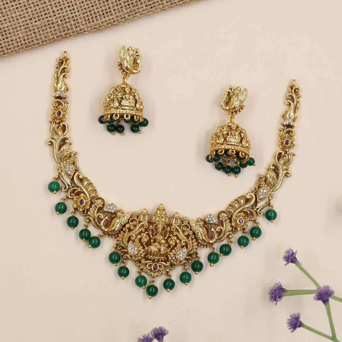 Royal Lakshmi necklace featuring elaborate curves, floral detailing and hanging accents