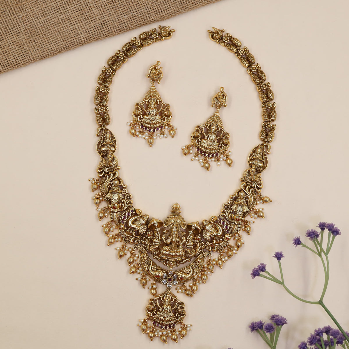 Temple-Inspired Long Haara Showcasing Lakshmi Centrepiece And Intricate Peacock Work