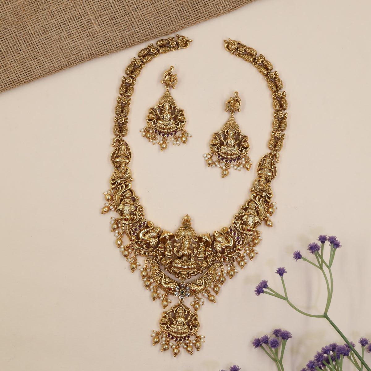 Temple-Inspired Long Haara Showcasing Lakshmi Centrepiece And Intricate Peacock Work