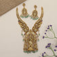A grand Krishna Necklace framed by sculpted peacocks and traditional detailing