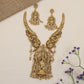 A grand Krishna Necklace framed by sculpted peacocks and traditional detailing