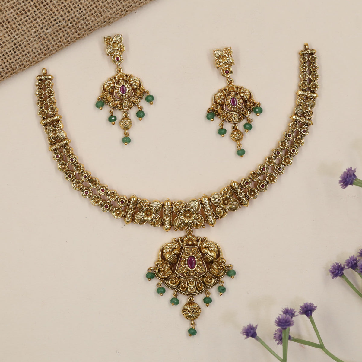 Heirloom-style Necklace showcasing intricate flowers, ornamental bars and a statement pendant