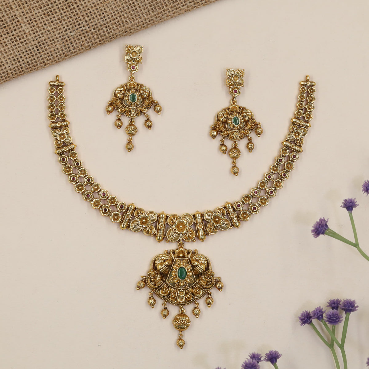 Heirloom-style Necklace showcasing intricate flowers, ornamental bars and a statement pendant