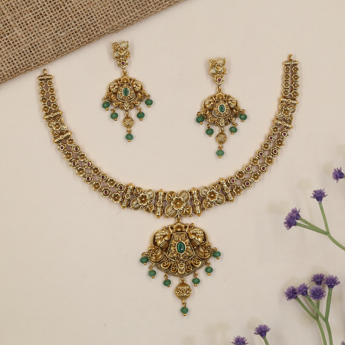 Heirloom-style Necklace showcasing intricate flowers, ornamental bars and a statement pendant