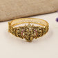 Festive Kada with a sculpted Radhe Krishna centre and detailed temple-style borders