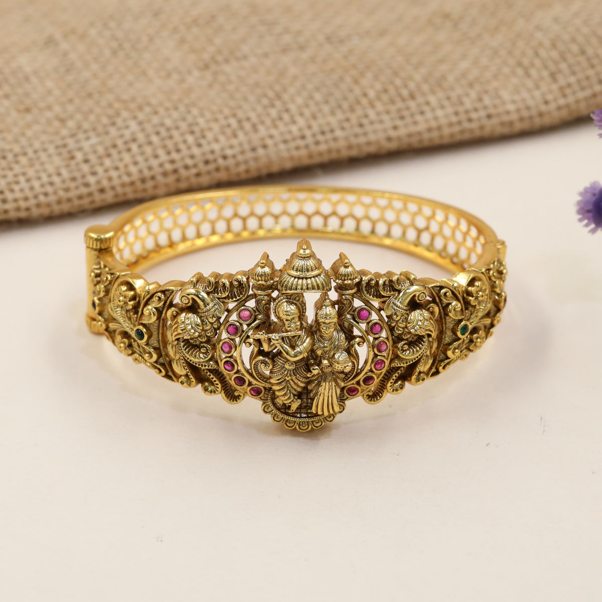 Festive Kada with a sculpted Radhe Krishna centre and detailed temple-style borders