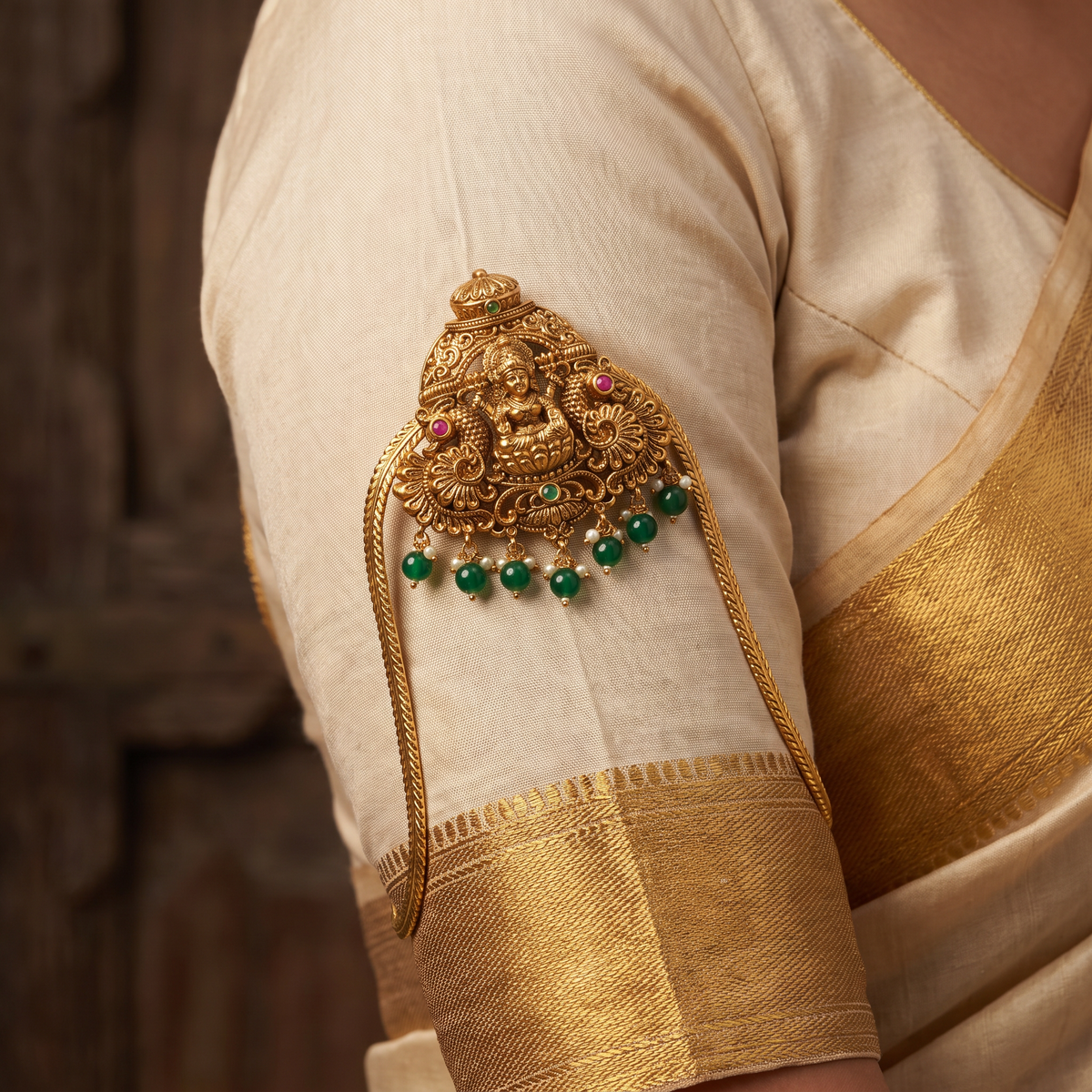 An elegant Antique Vanki centred on Lakshmi with ornate peacock detailing