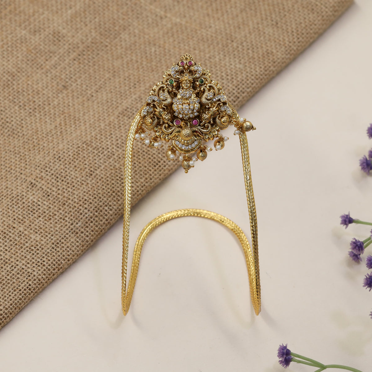 A heritage-inspired Vanki designed with detailed Lakshmi work and ornate borders