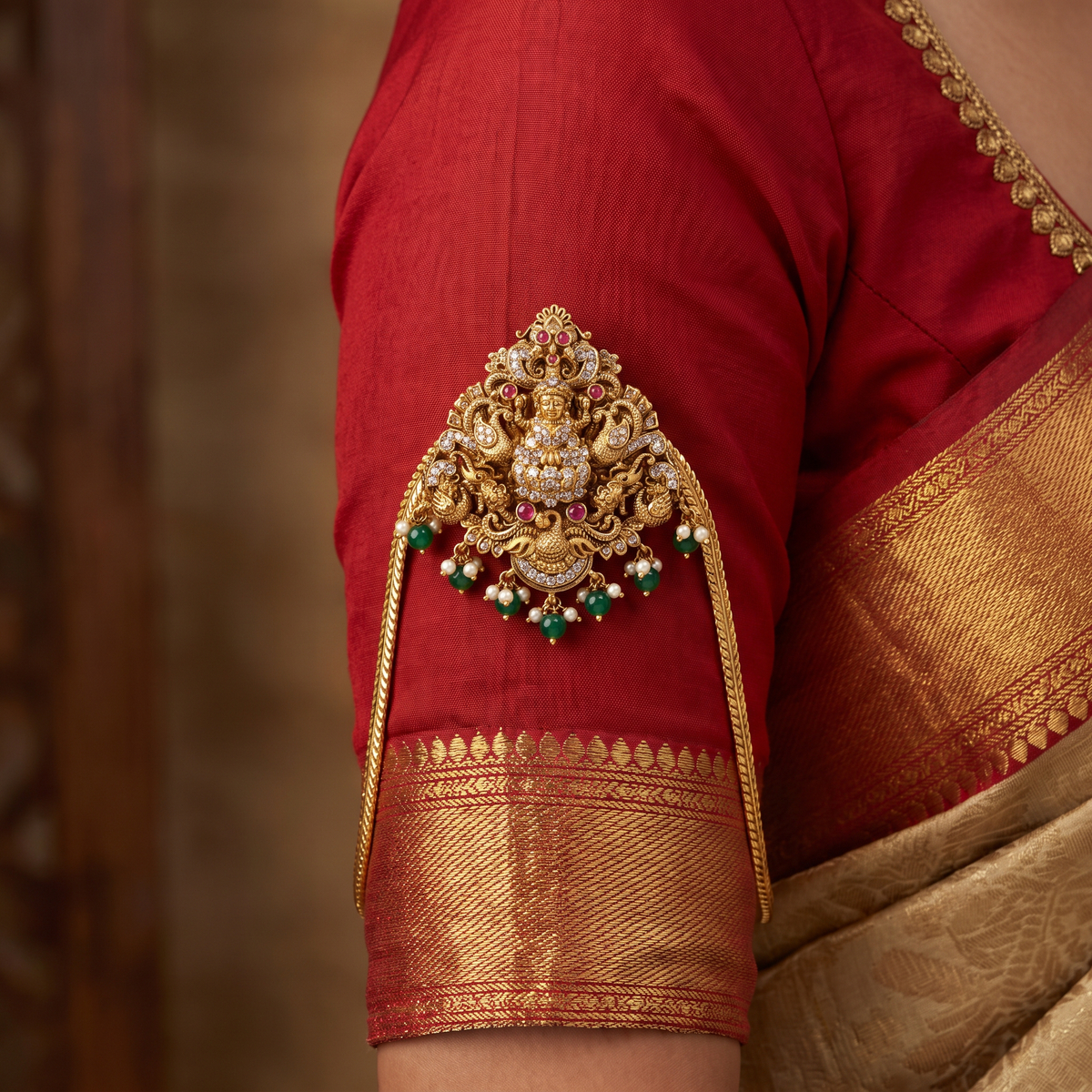 A heritage-inspired Vanki designed with detailed Lakshmi work and ornate borders