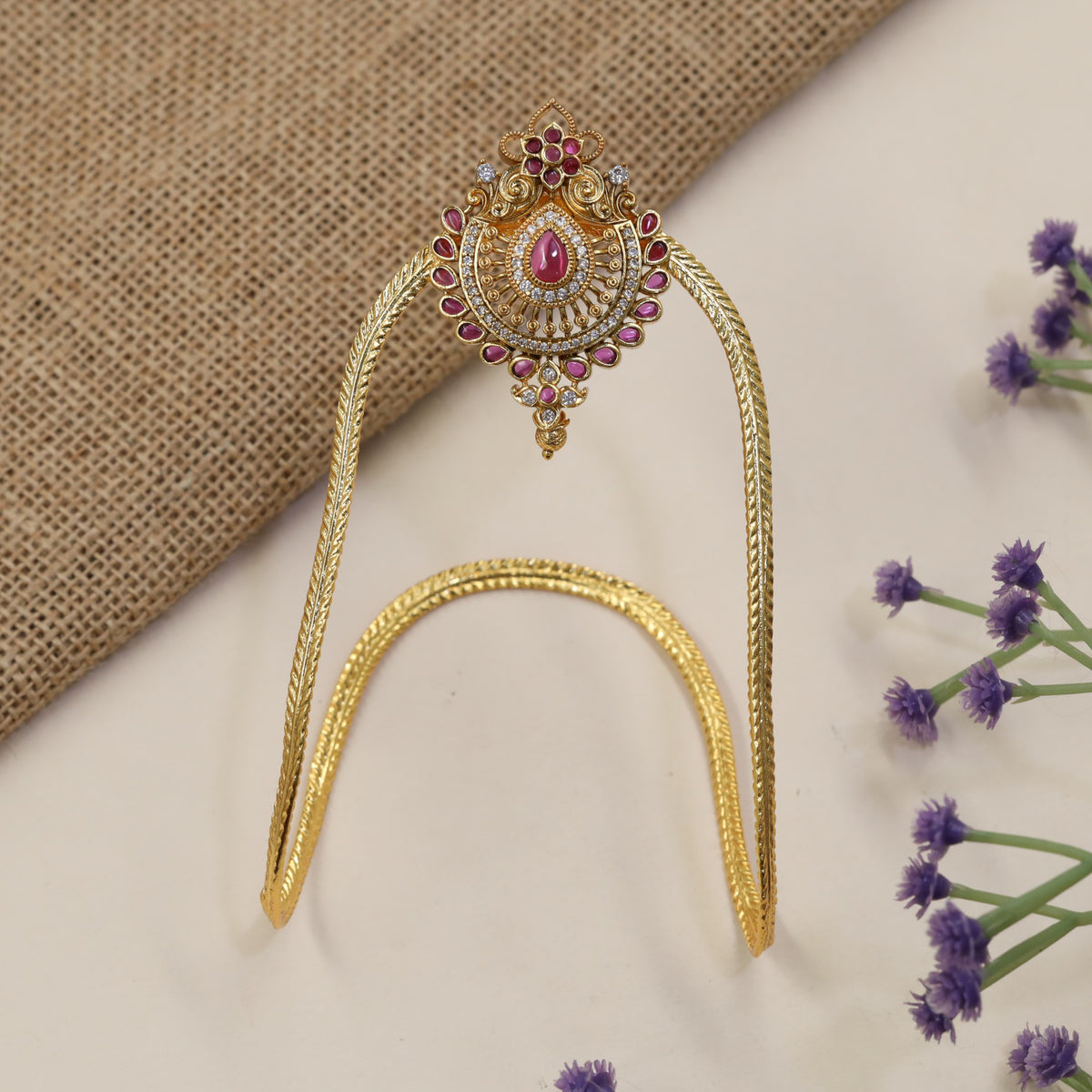 Signature Vanki featuring a floral crest, intricate scrollwork and refined traditional artistry