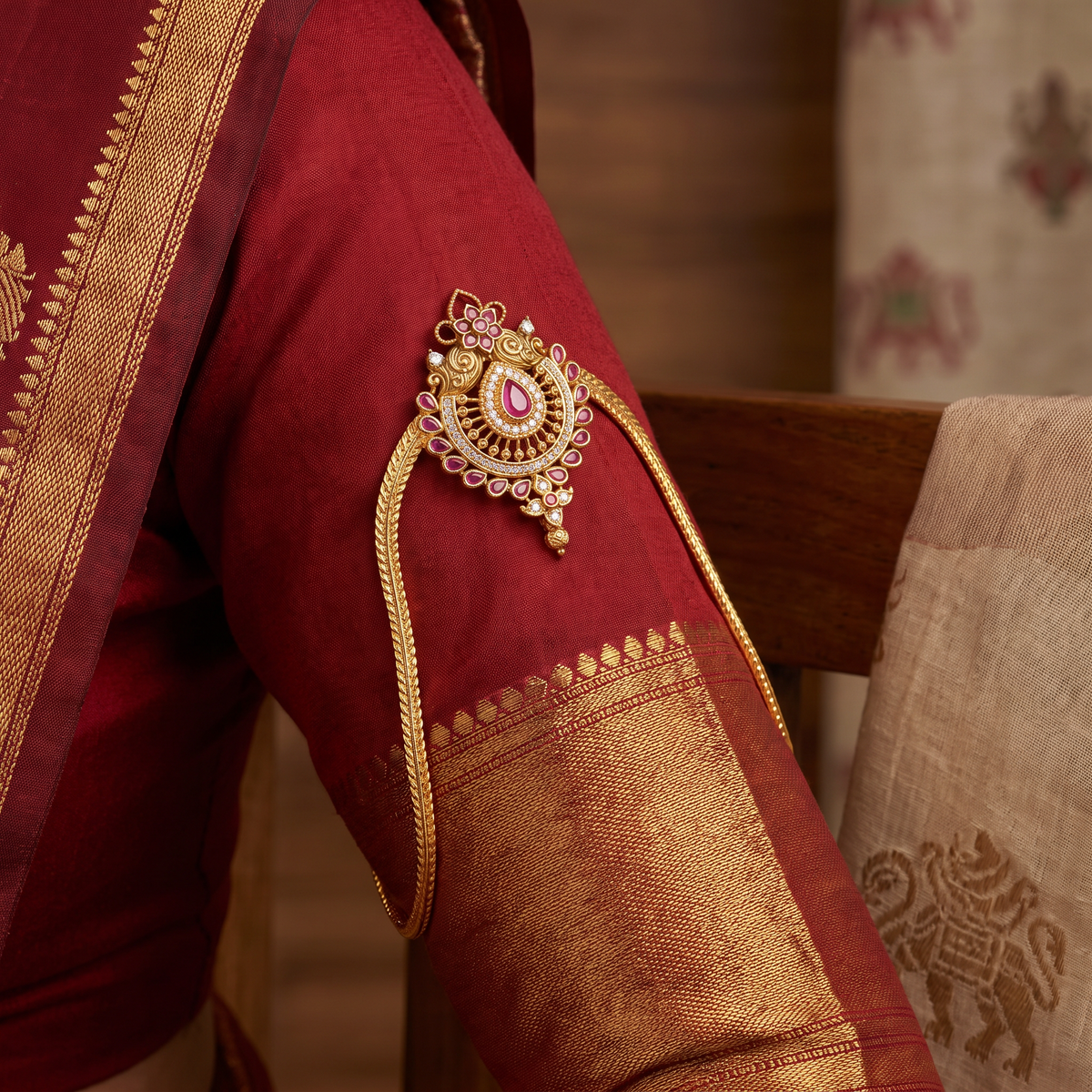 Signature Vanki featuring a floral crest, intricate scrollwork and refined traditional artistry