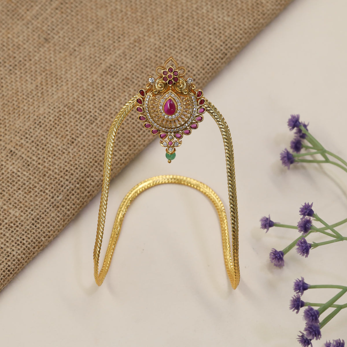 Signature Vanki featuring a floral crest, intricate scrollwork and refined traditional artistry