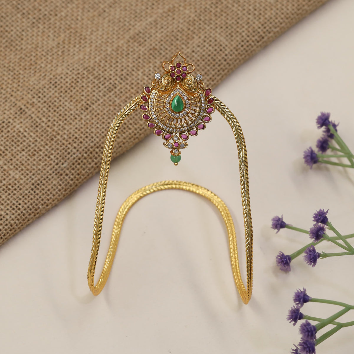 Signature Vanki featuring a floral crest, intricate scrollwork and refined traditional artistry
