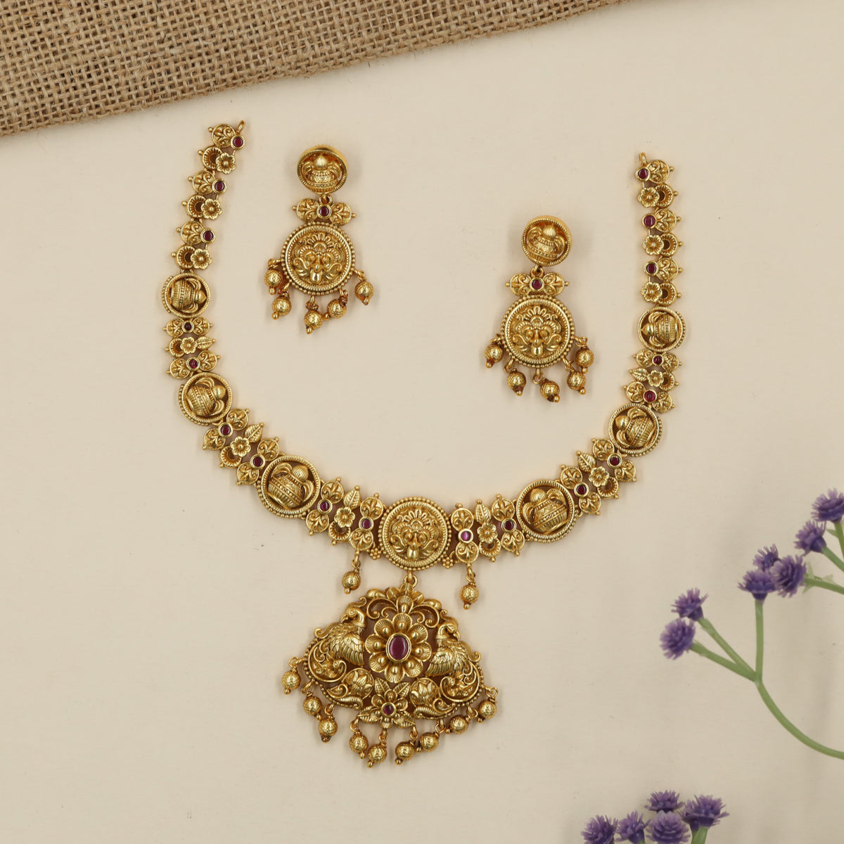 Royal Antique Necklace with a richly sculpted centre and graceful peacock forms