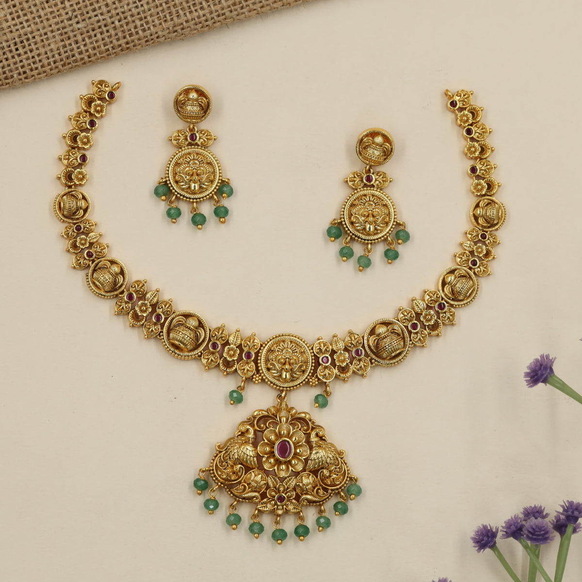 Royal Antique Necklace with a richly sculpted centre and graceful peacock forms