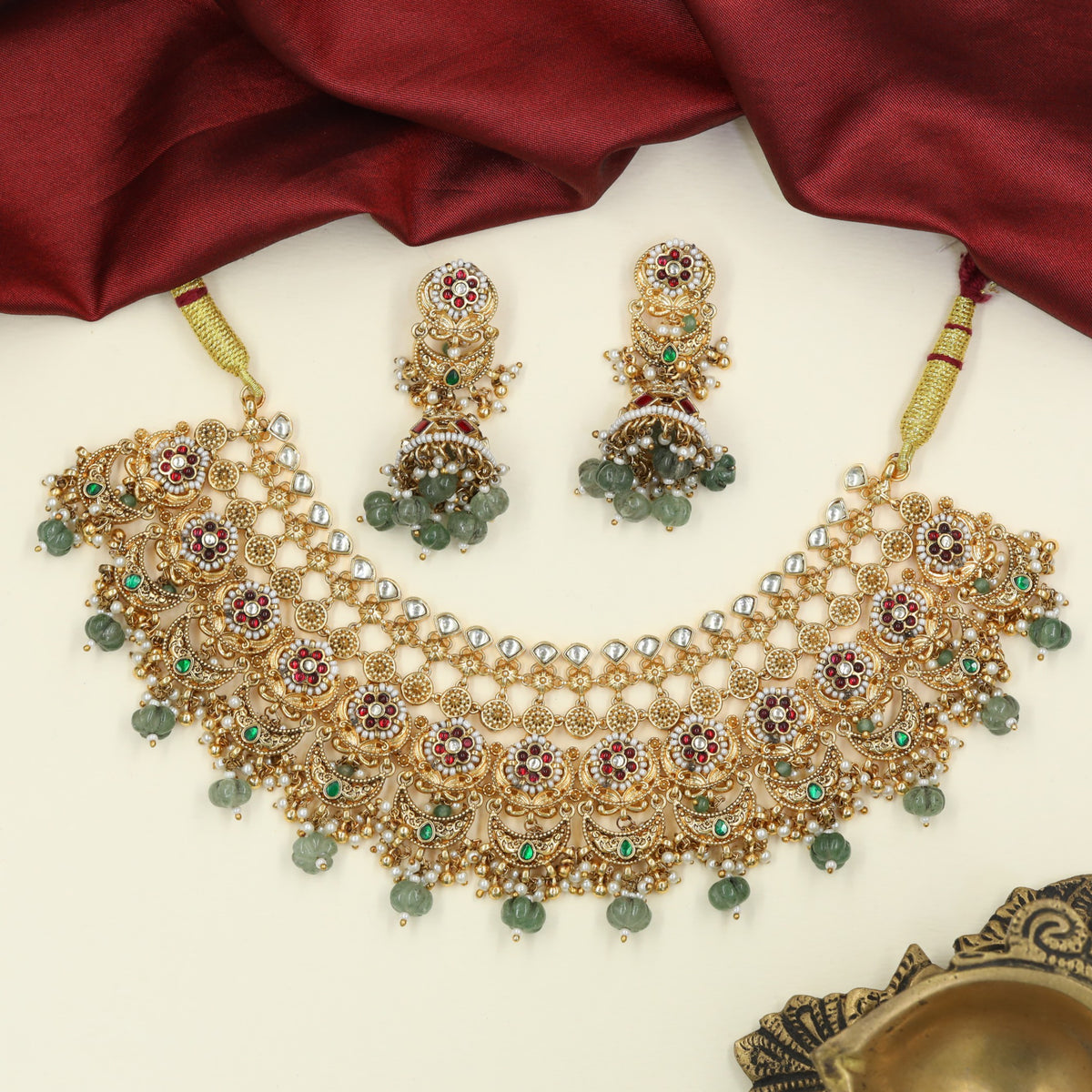 Signature Jadau Choker finished with floral stations, openwork circles and cascading drops