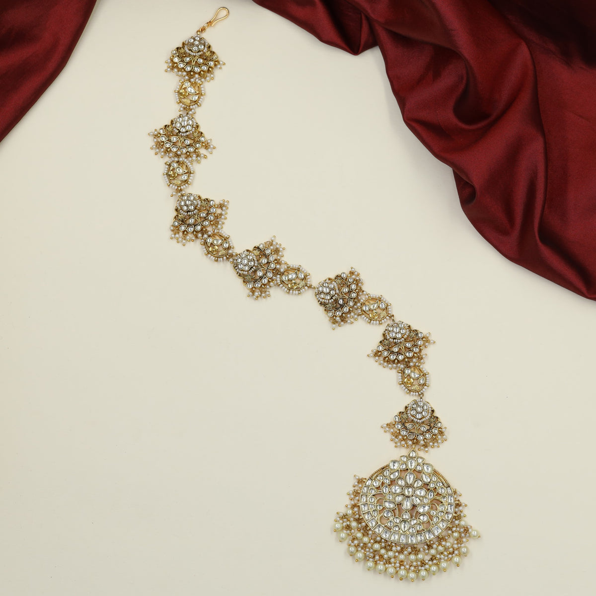 Statement Jadau Long Jade with repeating floral elements and grand circular ends