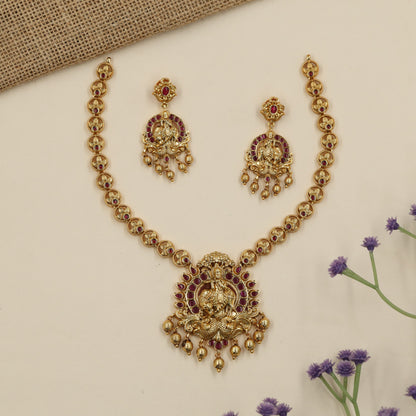 A heritage-inspired Antique Necklace showcasing Krishna and peacock detailing