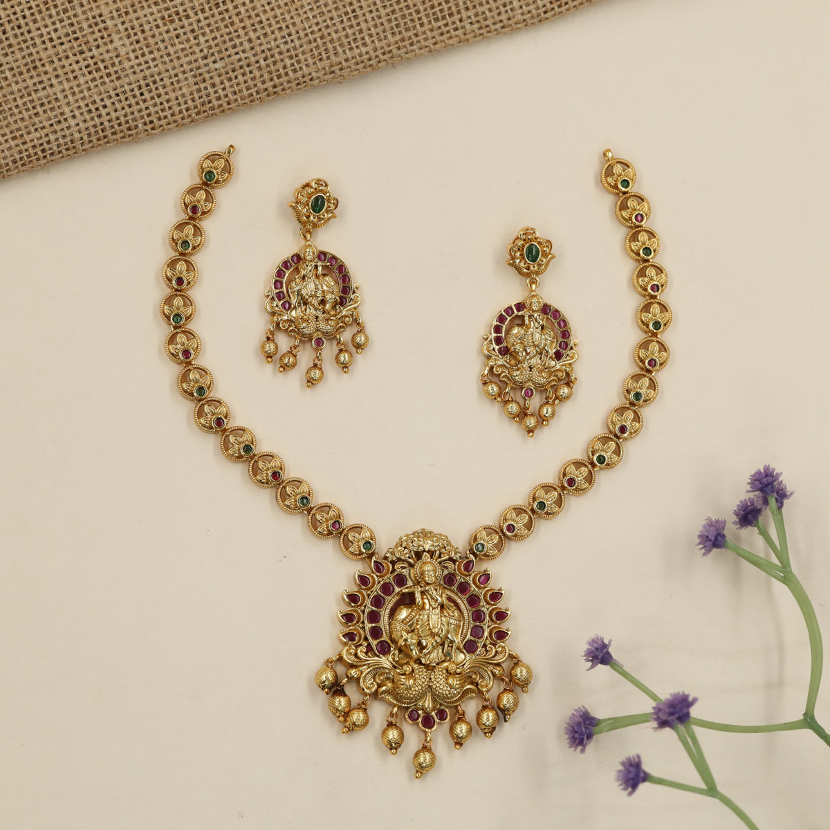 A heritage-inspired Antique Necklace showcasing Krishna and peacock detailing