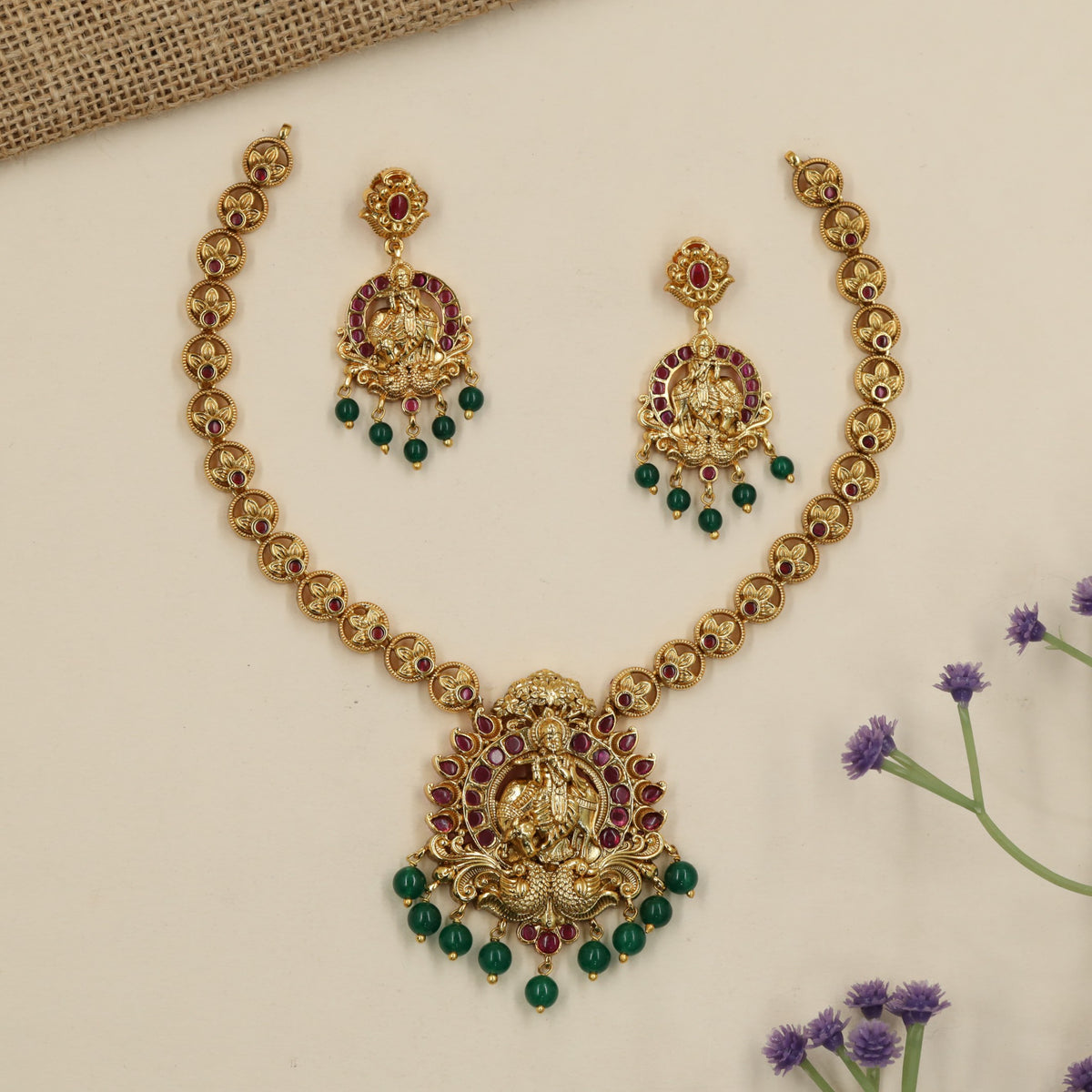 A heritage-inspired Antique Necklace showcasing Krishna and peacock detailing