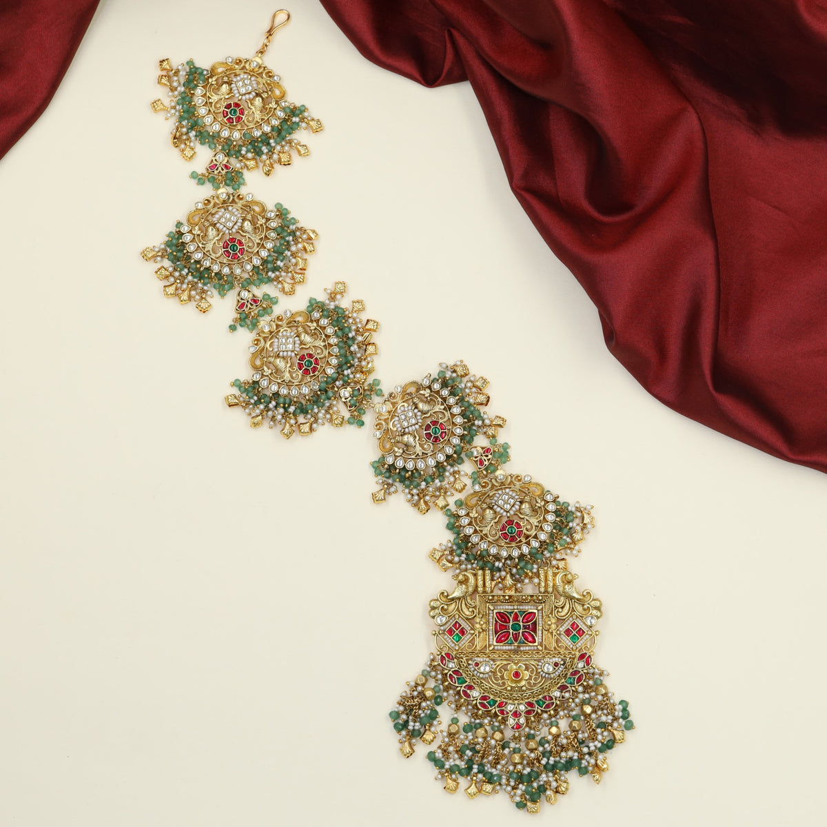Antique Long Jades adorned with intricate peacock detailing and ornate pendant work
