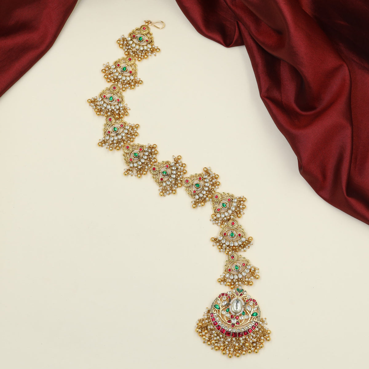 Grand Antique Long Jades with radiant circular pendant detailing