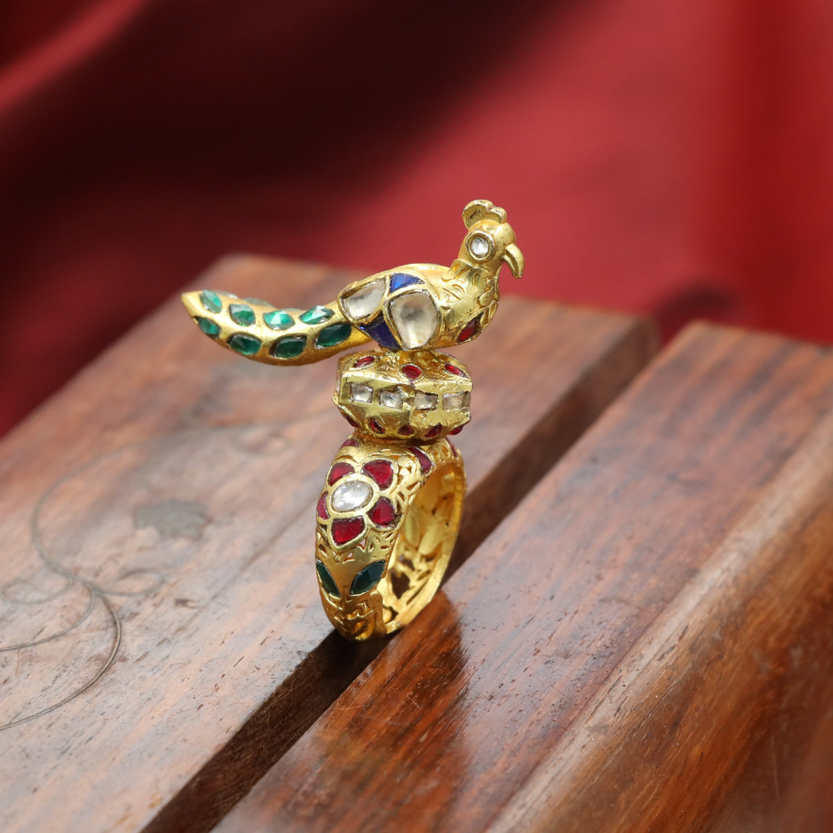 Jadau Finger Ring with sculpted peacock and sweeping tail detailing