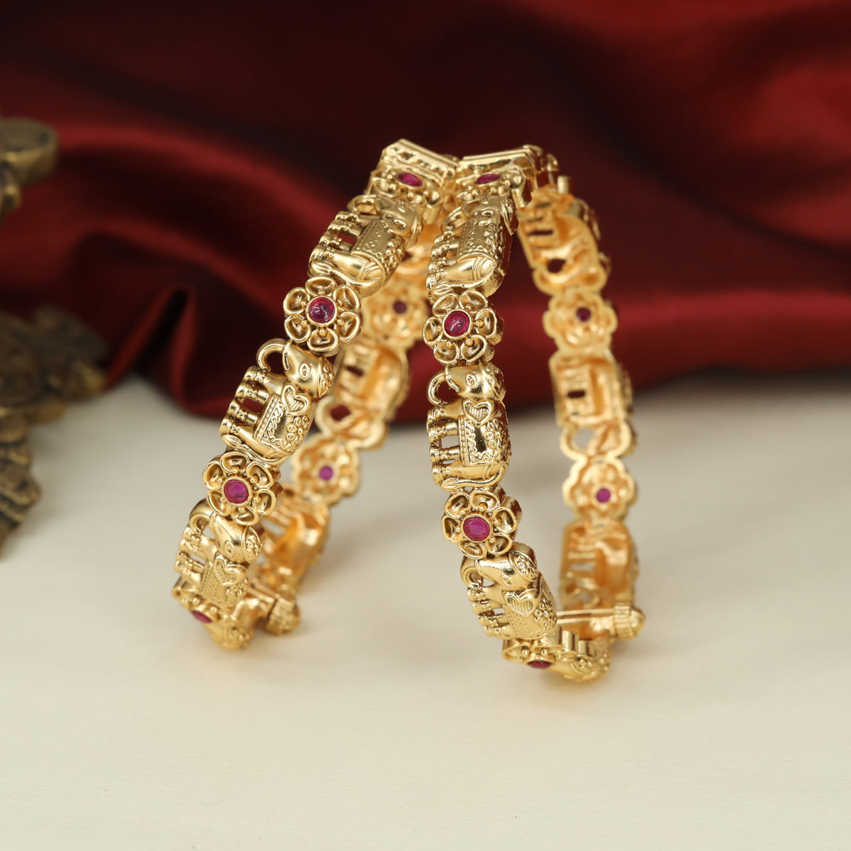 Classic Antique Bangless with Repeating Elephant Reliefs and Decorative Rosettes