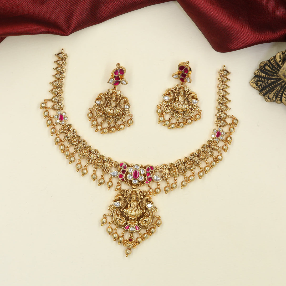 Richly Crafted Antique Necklace featuring Sculpted Lakshmi and Fine Floral Ornamentation