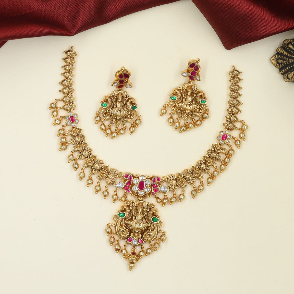 Richly Crafted Antique Necklace featuring Sculpted Lakshmi and Fine Floral Ornamentation