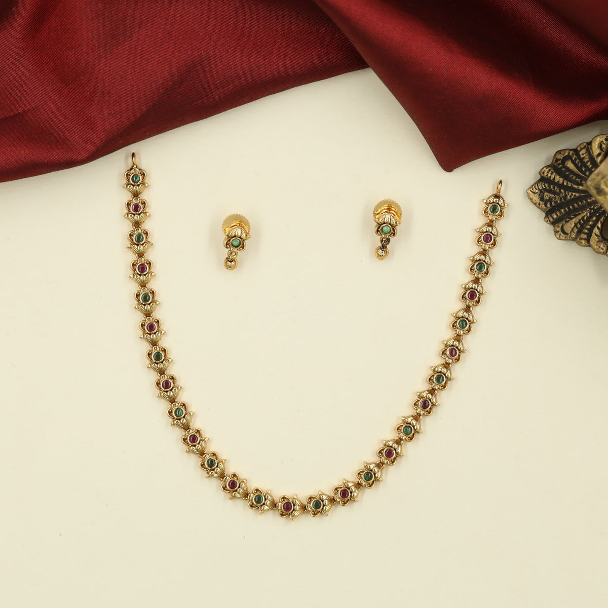 Traditional Necklace with Repeating Round Accents and Intricate Decorative Links