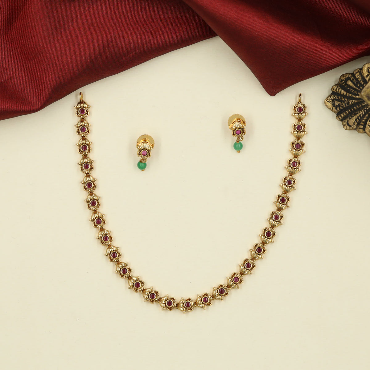 Traditional Necklace with Repeating Round Accents and Intricate Decorative Links