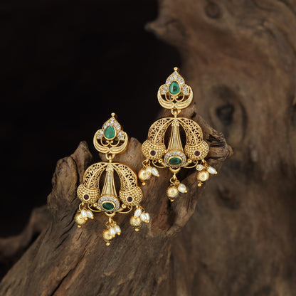 Fine Antique Hangings with Teardrop Accents and Sculpted Decorative Panels