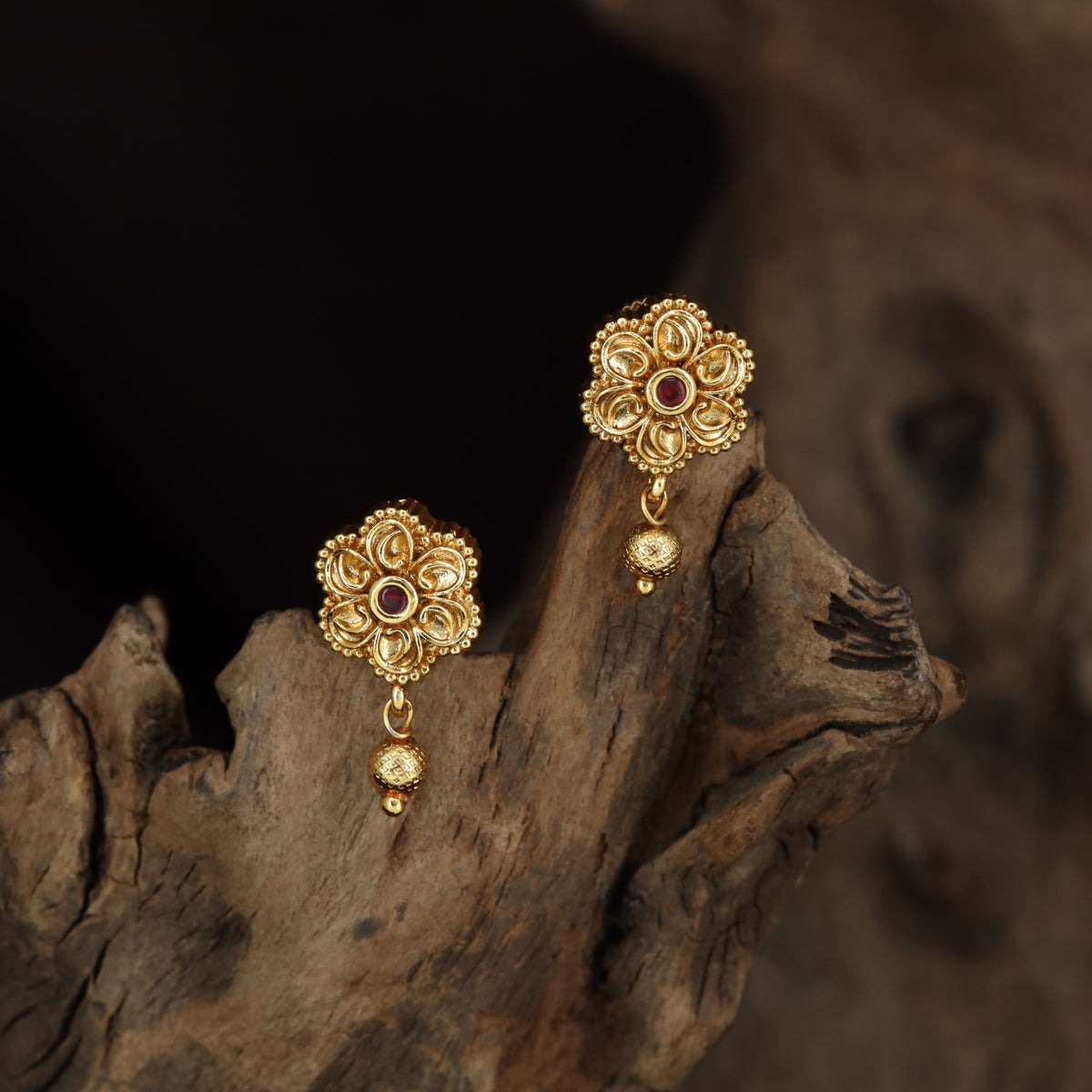 Antique Stud with Symmetrical Floral Elements and Fine Border Detailing