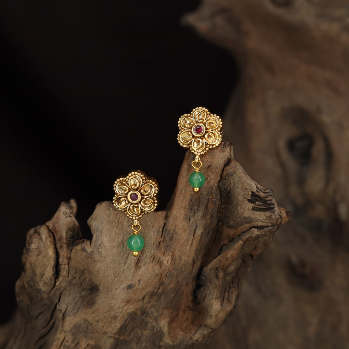Antique Stud with Symmetrical Floral Elements and Fine Border Detailing