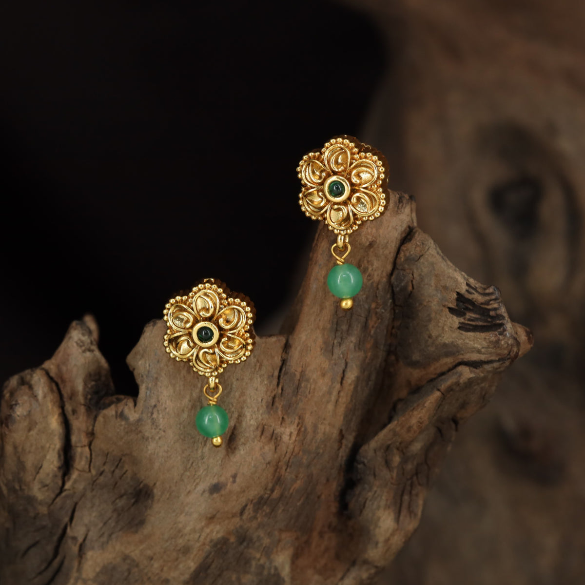 Antique Stud with Symmetrical Floral Elements and Fine Border Detailing