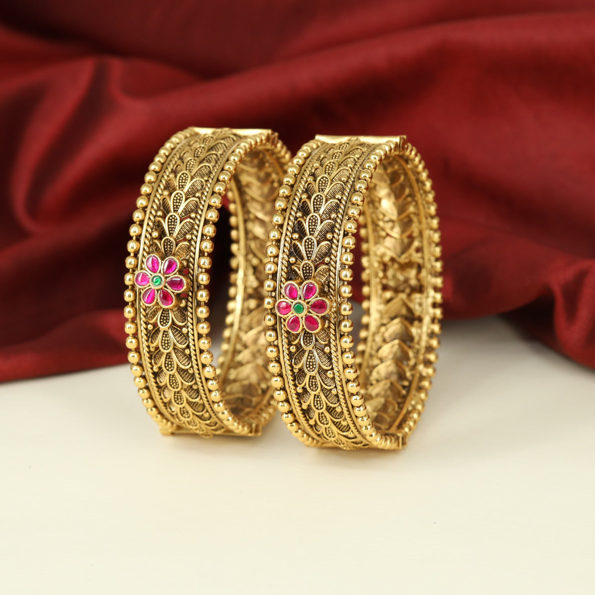 Classic Antique Bangles combining Floral Accents with Intricate Filigree Panels