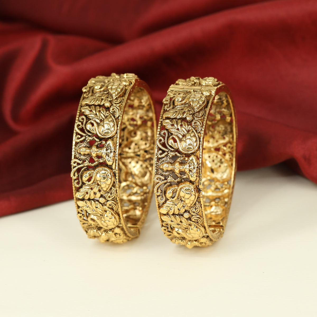 Antique Bangles showcasing Lakshmi Reliefs with Intricate Botanical Ornamentation